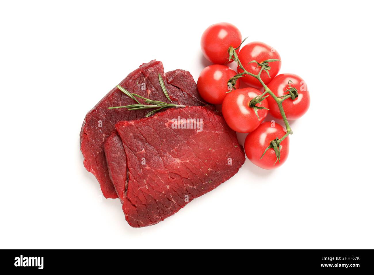 Raw beef steaks with tomatoes isolated on white background Stock Photo