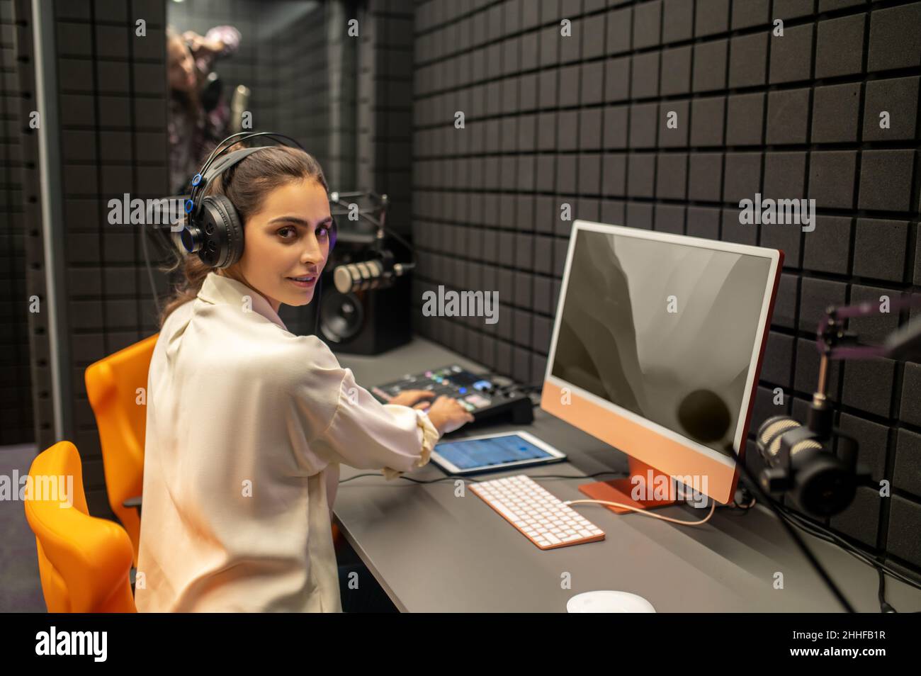 Professional working on the mixing console in the studio Stock Photo