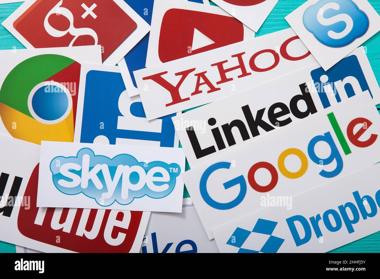 KIEV, UKRAINE - MARCH 10, 2017. Collection of popular social media logos printed on paper: You Tube, Google Plus, Yahoo, Linkedin, Skype, Dropbox and Stock Photo