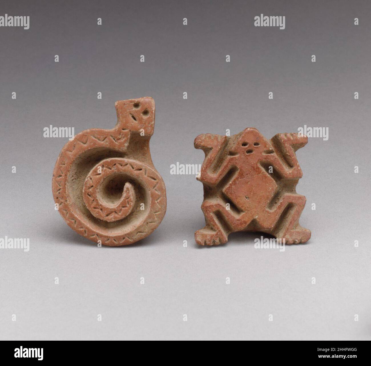 Two Flat Stamps 1st–7th century Atlantic Watershed Ceramic stamps are found in Costa Rican burials, suggesting that their importance extended beyond utilitarian. Much speculation has been made with regard to the material that these stamps were intended to imprint, including paper, textiles, and the human body. The curved shape of the printing surface supports the function of body painting most strongly. This theory is reinforced by the presence of stamp motifs on Costa Rican ceramic figure sculpture. The designs of the stamps can be divided into two categories, those that mimic the geometricit Stock Photo