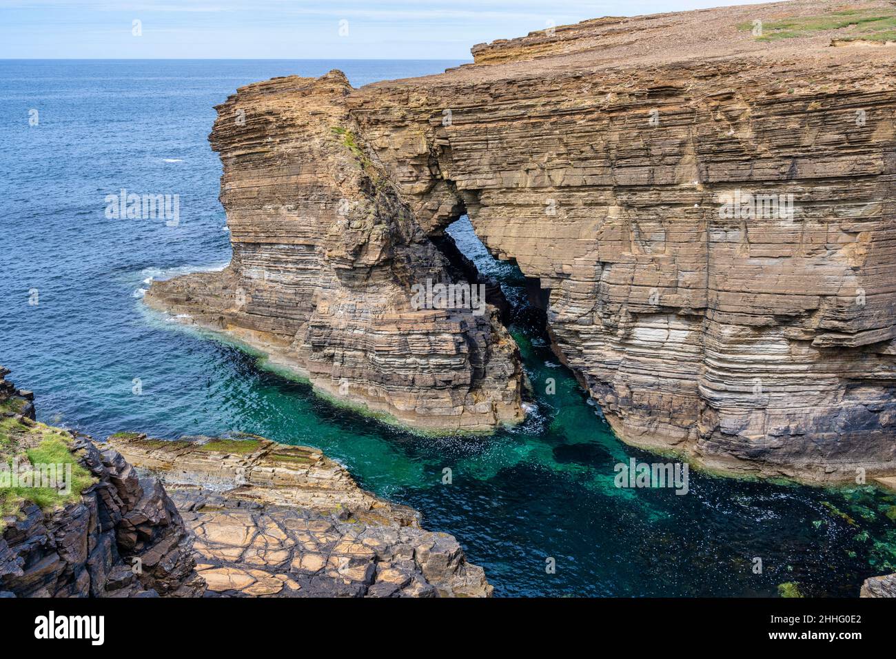 Rock arch near Brough of Bigging on Yesnaby coastline on west coast of Mainland Orkney in Scotland Stock Photo