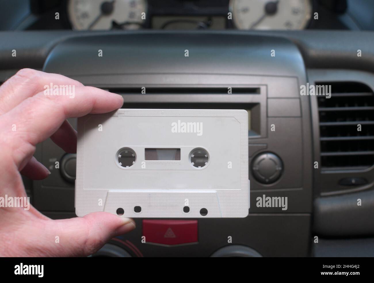 holding audio cassette in car Stock Photo