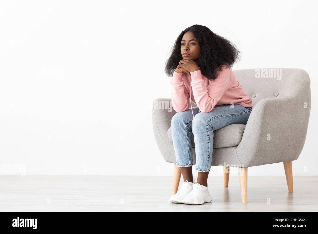 African american woman sitting hi-res stock photography and images - Alamy
