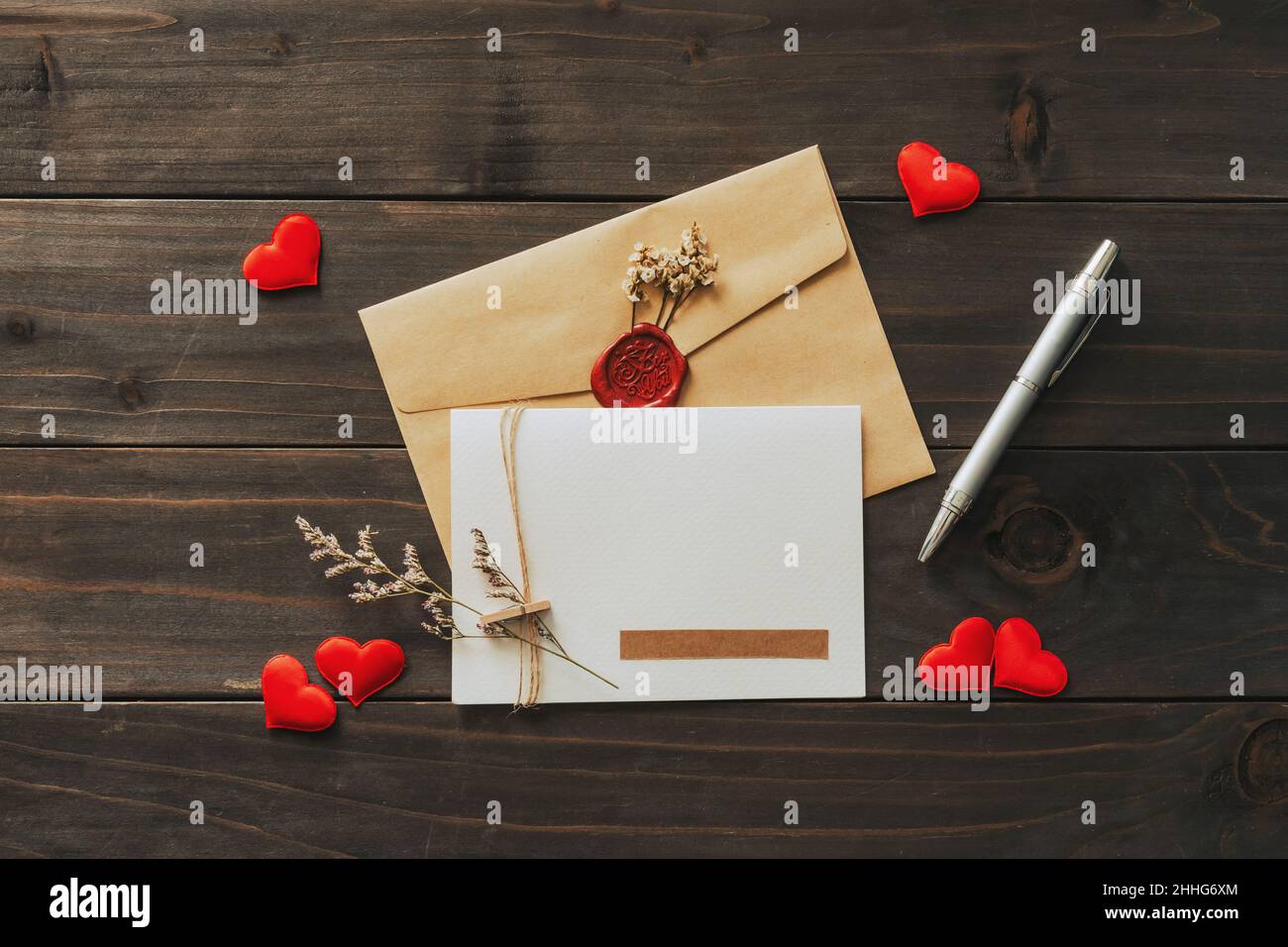 Valentine card with red heart on wooden background Stock Photo