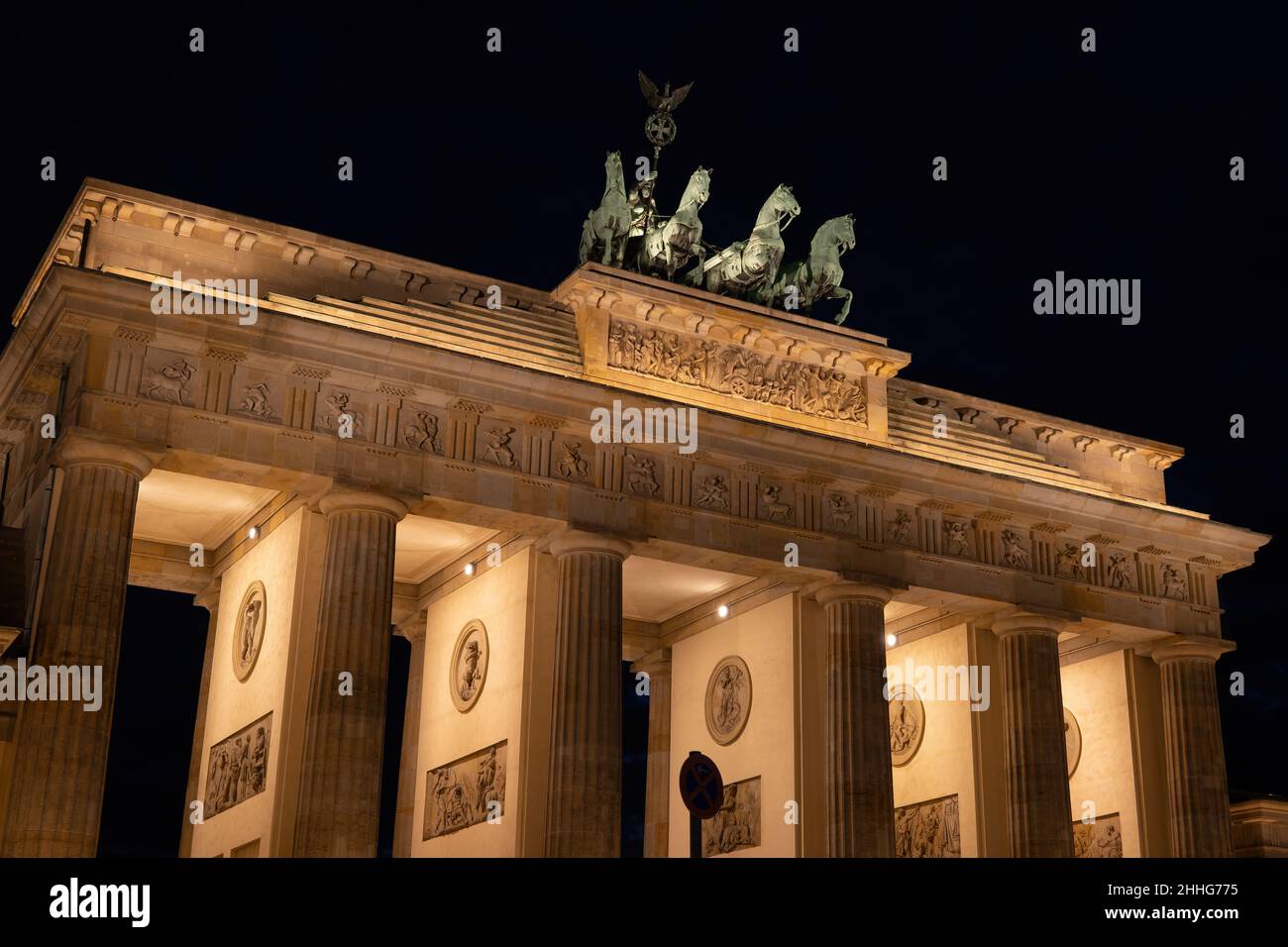 The Brandenburg Gate illuminated at night in city of Berlin, Germany. Stock Photo