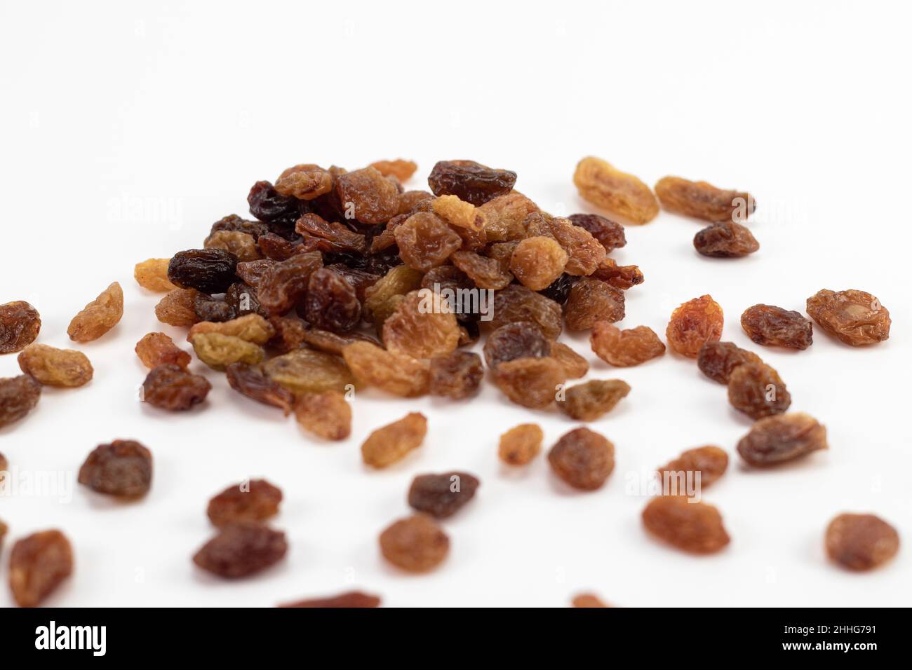 Tasty dried raisins isolated on a white background Stock Photo