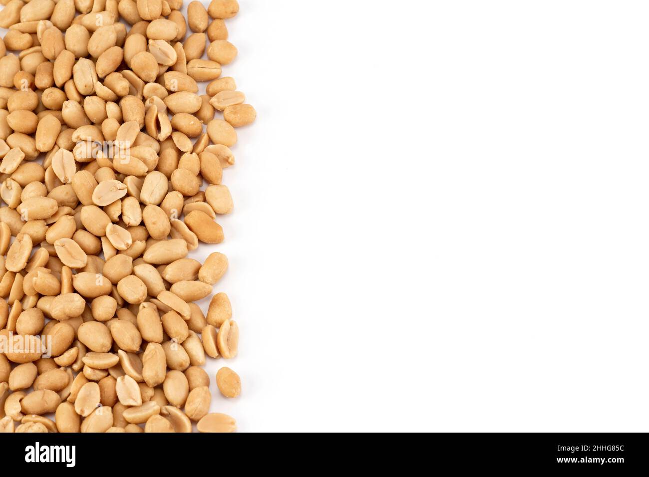 Salted peanuts background. Top view, close up, place for text. Blank for text. Stock Photo