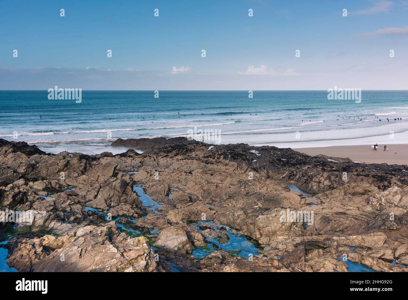 Rocks in the littoral zone exposed by a low tide at Fistral Beach in ...