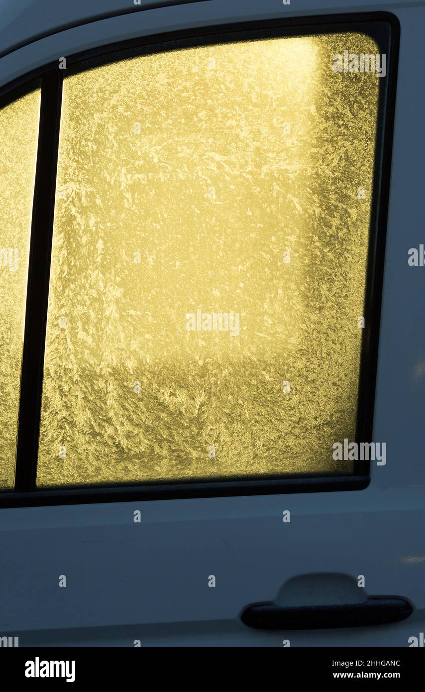 A morning light comes through the frosted windows of a car in Dagenham