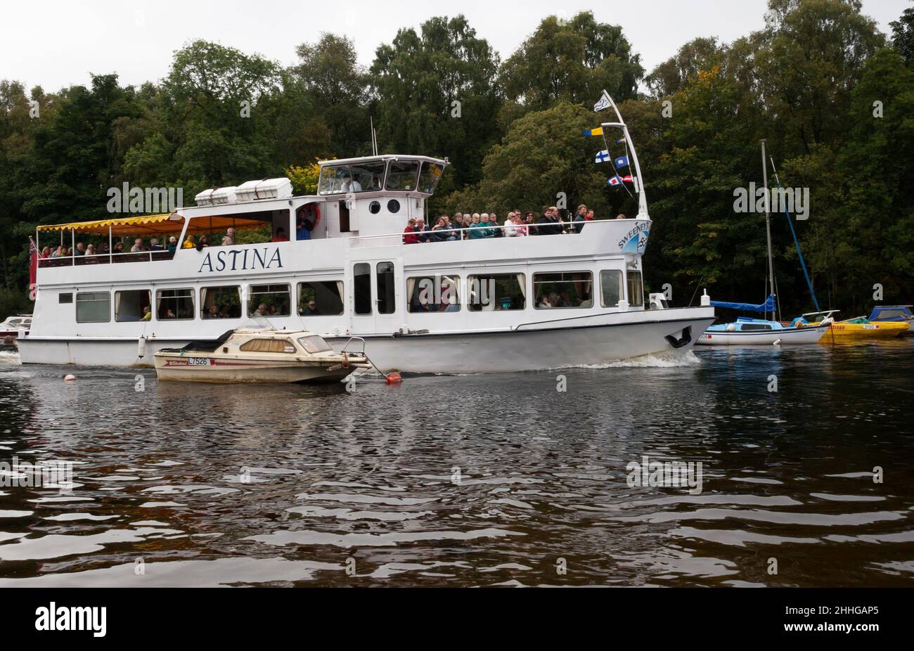 Tourist boat, Astina from Sweeney Cruises on the River Leven at Balloch heading to Loch Lomond, Scotland Stock Photo