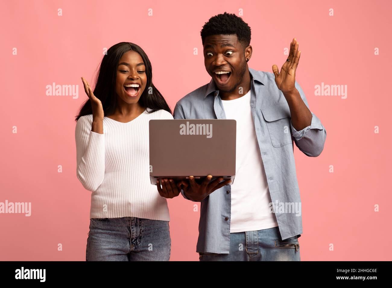 Happy african american couple trading online, using computer Stock ...