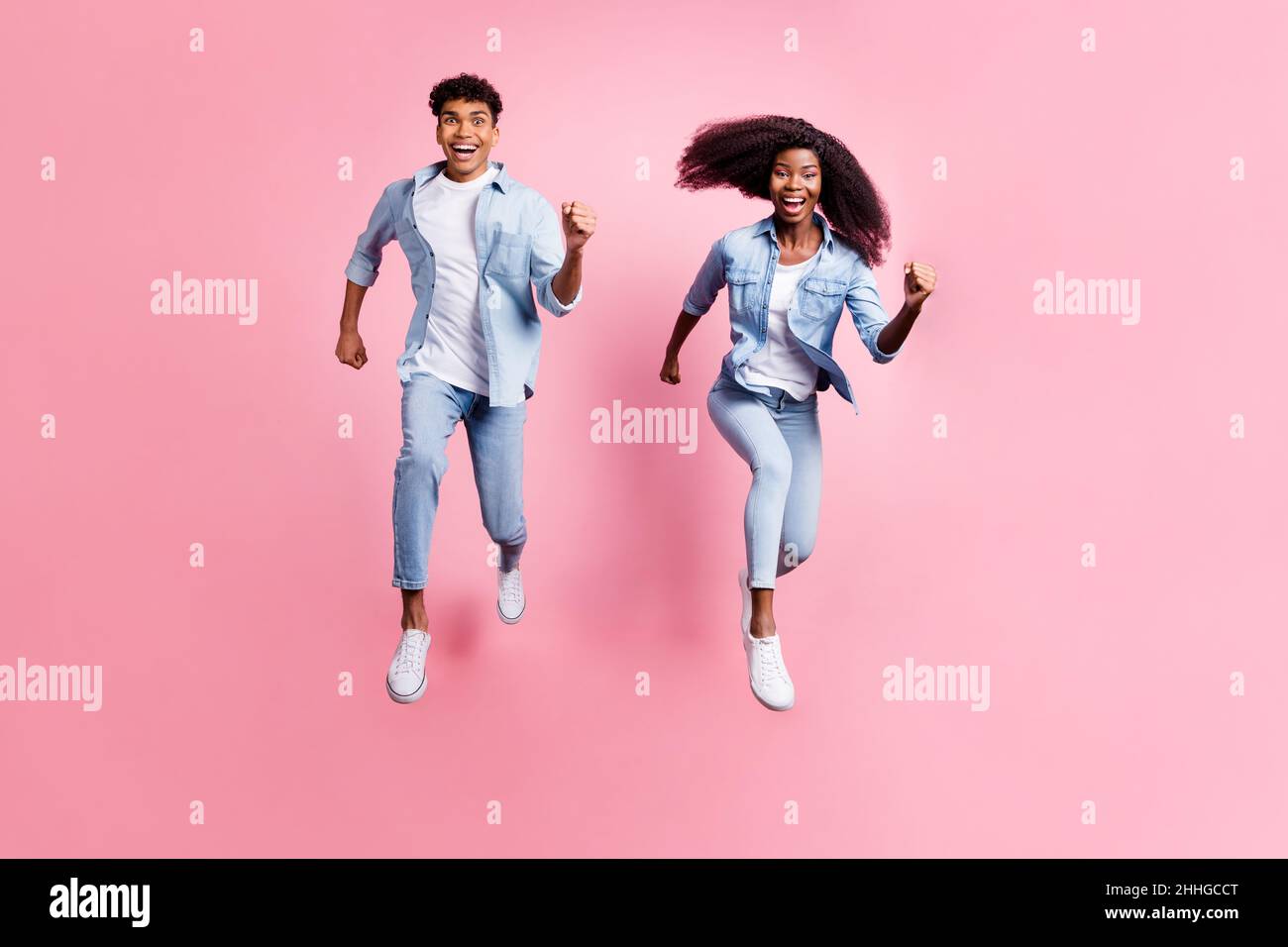 Running Around Smiling Full size portrait of two excited dark skin persons running open mouth ...