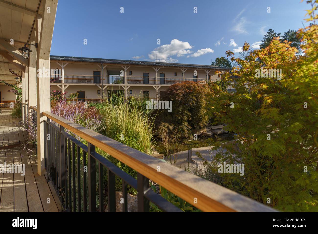 View from terrace of modern hotel with garden and pond Stock Photo