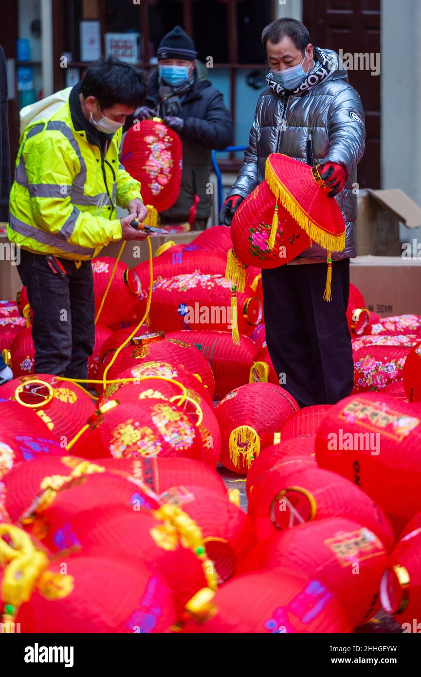 London, UK.  24 January 2022.   Workmen assemble lanterns in Chinatown ahead of Chinese New Year and The Year of the Tiger officially begins on 1 February.  Festivities on Chinatown are scaled back this year to the pandemic.  Credit: Stephen Chung / Alamy Live News Stock Photo
