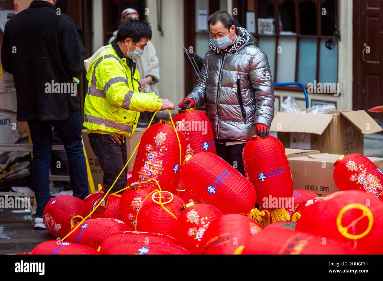 London, UK.  24 January 2022.   Workmen assemble lanterns in Chinatown ahead of Chinese New Year and The Year of the Tiger officially begins on 1 February.  Festivities on Chinatown are scaled back this year to the pandemic.  Credit: Stephen Chung / Alamy Live News Stock Photo