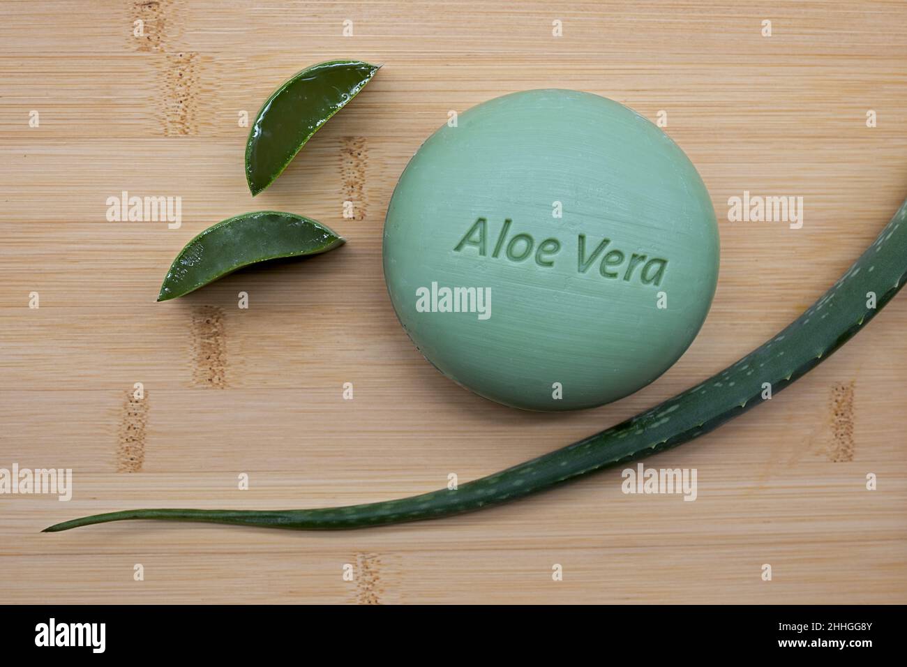 aloe vera soap with fresh aloe vera leaf on bamboo background Stock Photo