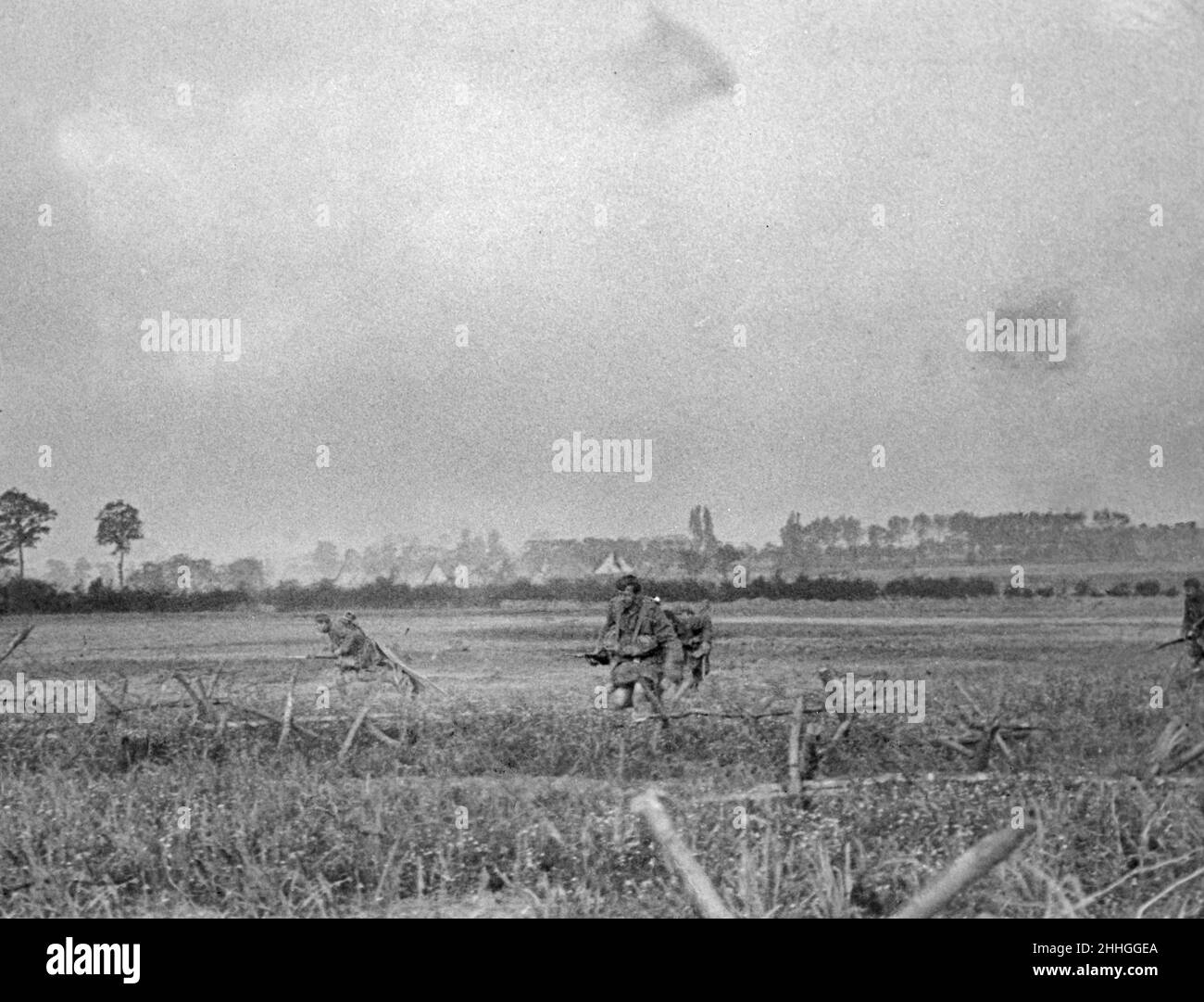 6am 16 June 1915 photograph taken by Private Frederick Fyfe Z Company 1/10th King's Regiment (Liverpool Scottish) who was brought down wounded a few yards in front of a German Advance trench at Bellewaarde Farm near Hooge. Members of the  Z Company 1/10th Kings Regiment are seen charging a German trench which they captured. Stock Photo