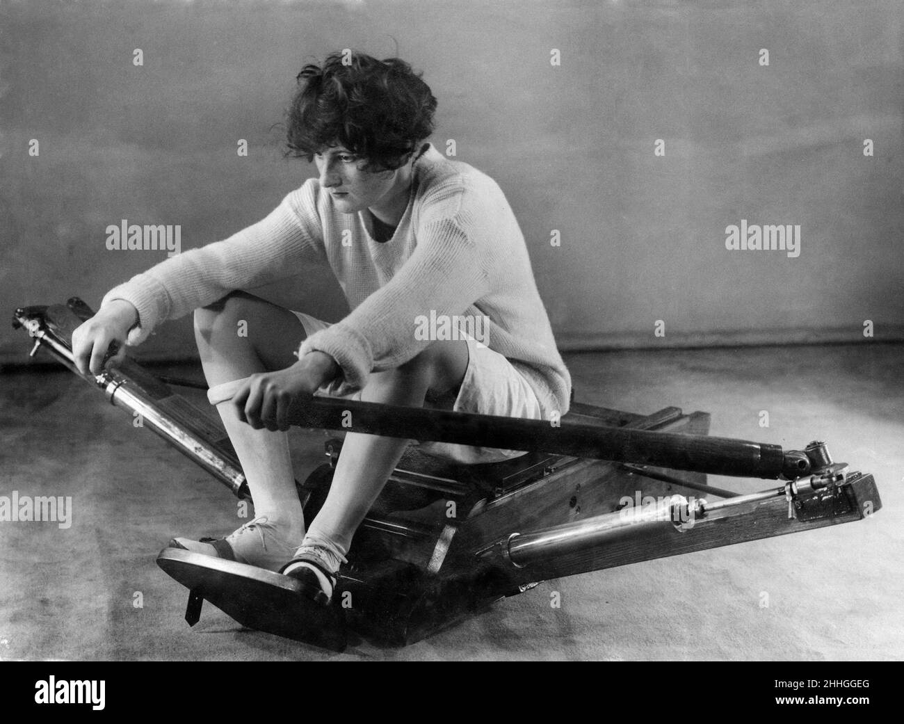 Overwhelming evidence that sculling, if properly done, is a suitable sport for women has been obtained by The Daily Mirror. Pictured, the wrong method with shoulders bent forward and so cramping the lungs, straining the back and over-exerting the muscles. 27th February 1925. Stock Photo