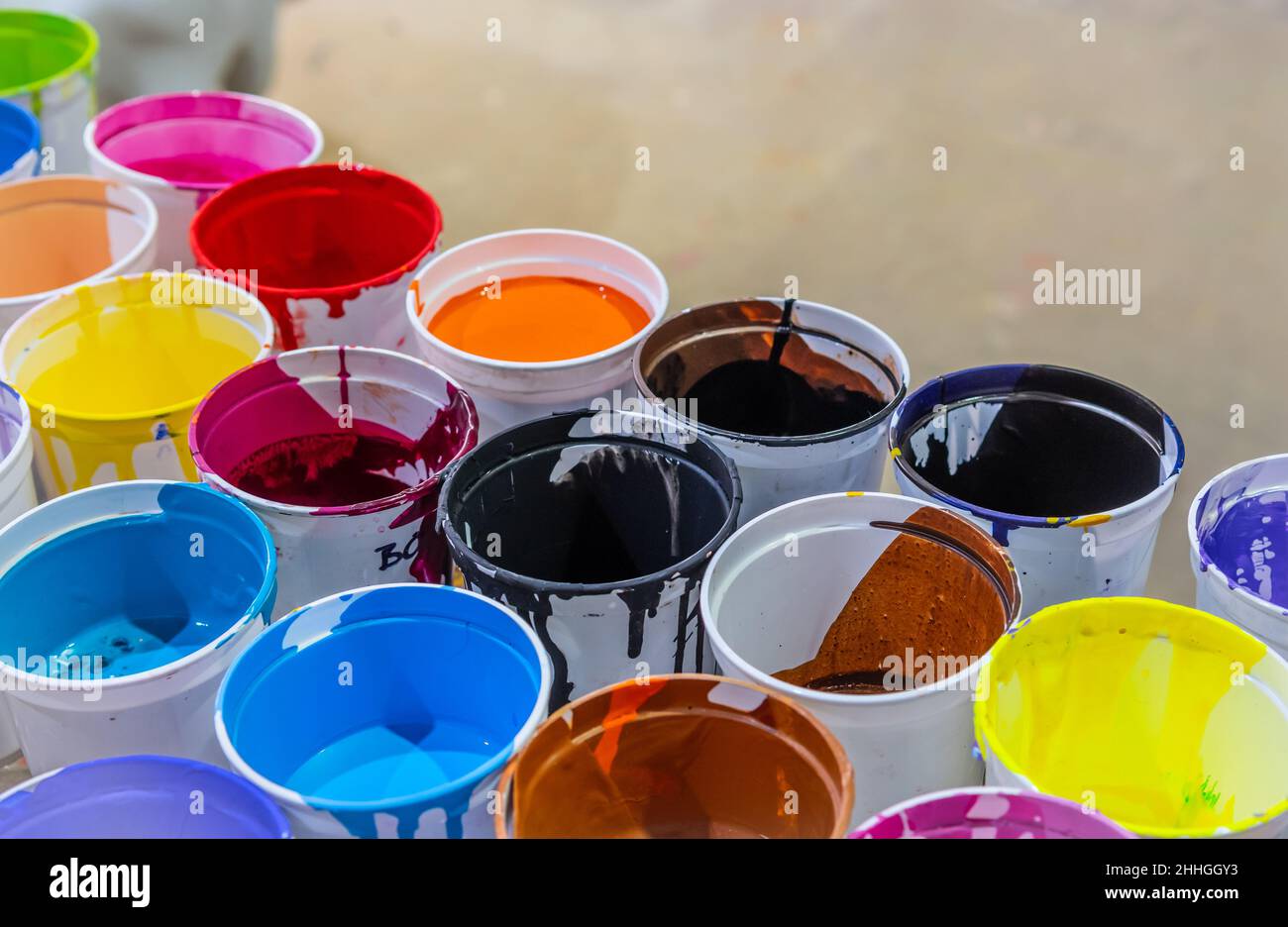 Mardi Gras World, colorful paint in artist studio used to design and decorate Mardi Gras parade floats, New Orleans, Louisiana, USA. Stock Photo