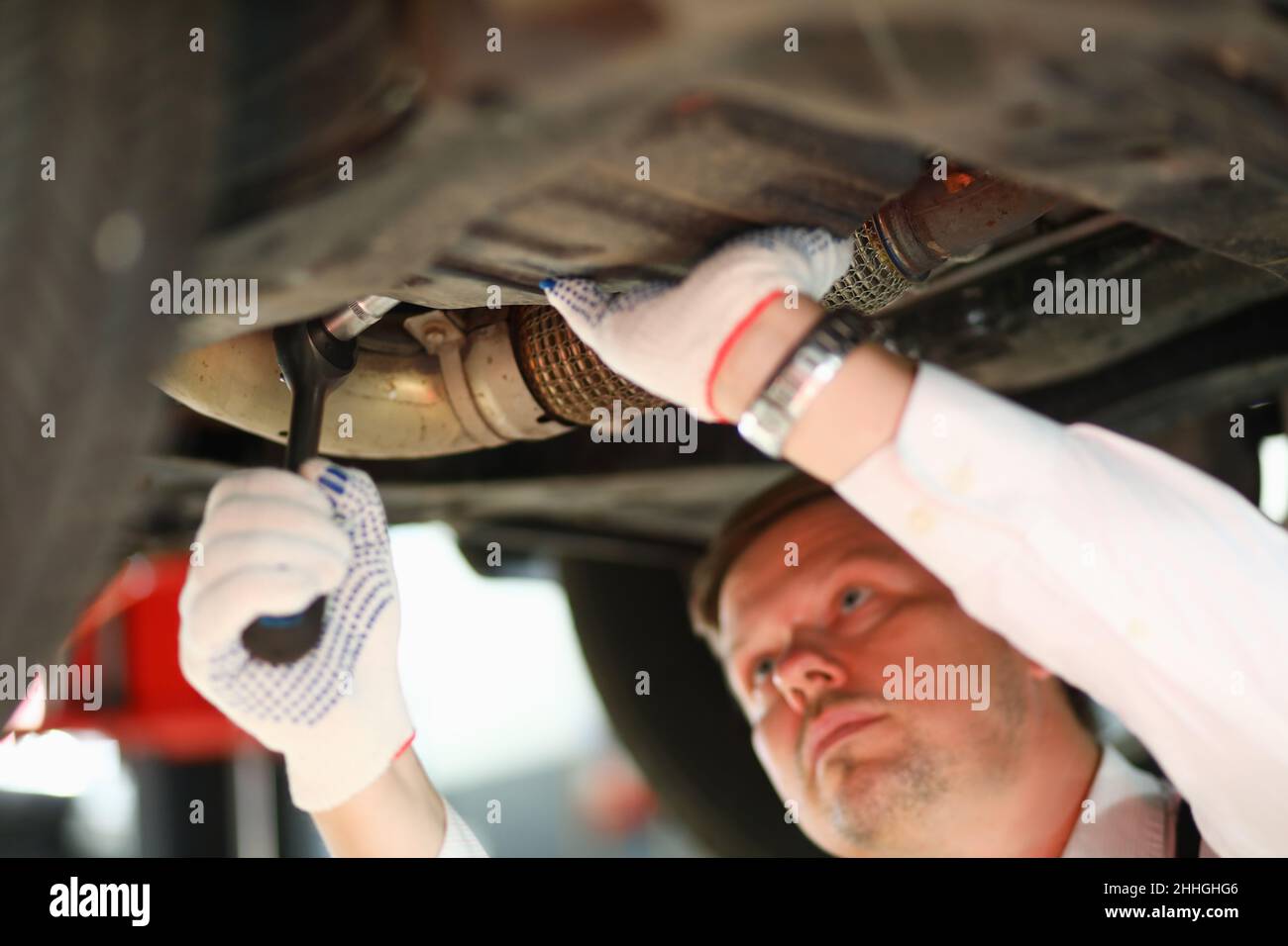 Auto mechanic repairs car suspension closeup. Car services