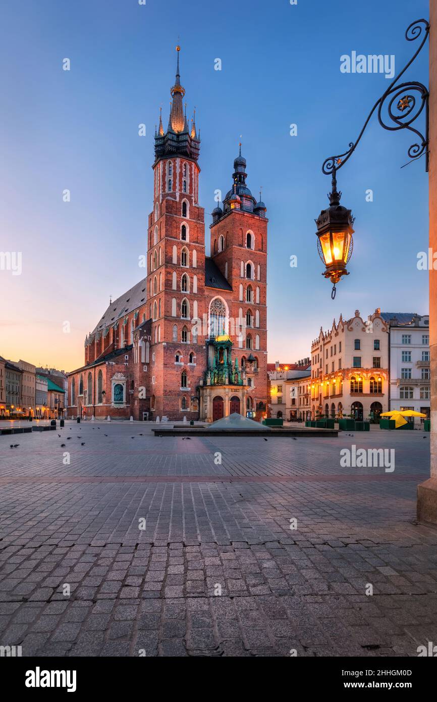 Krakow, Poland. HDR image of illuminated St. Mary's Basilica (Bazylika Mariacka) on sunrise Stock Photo