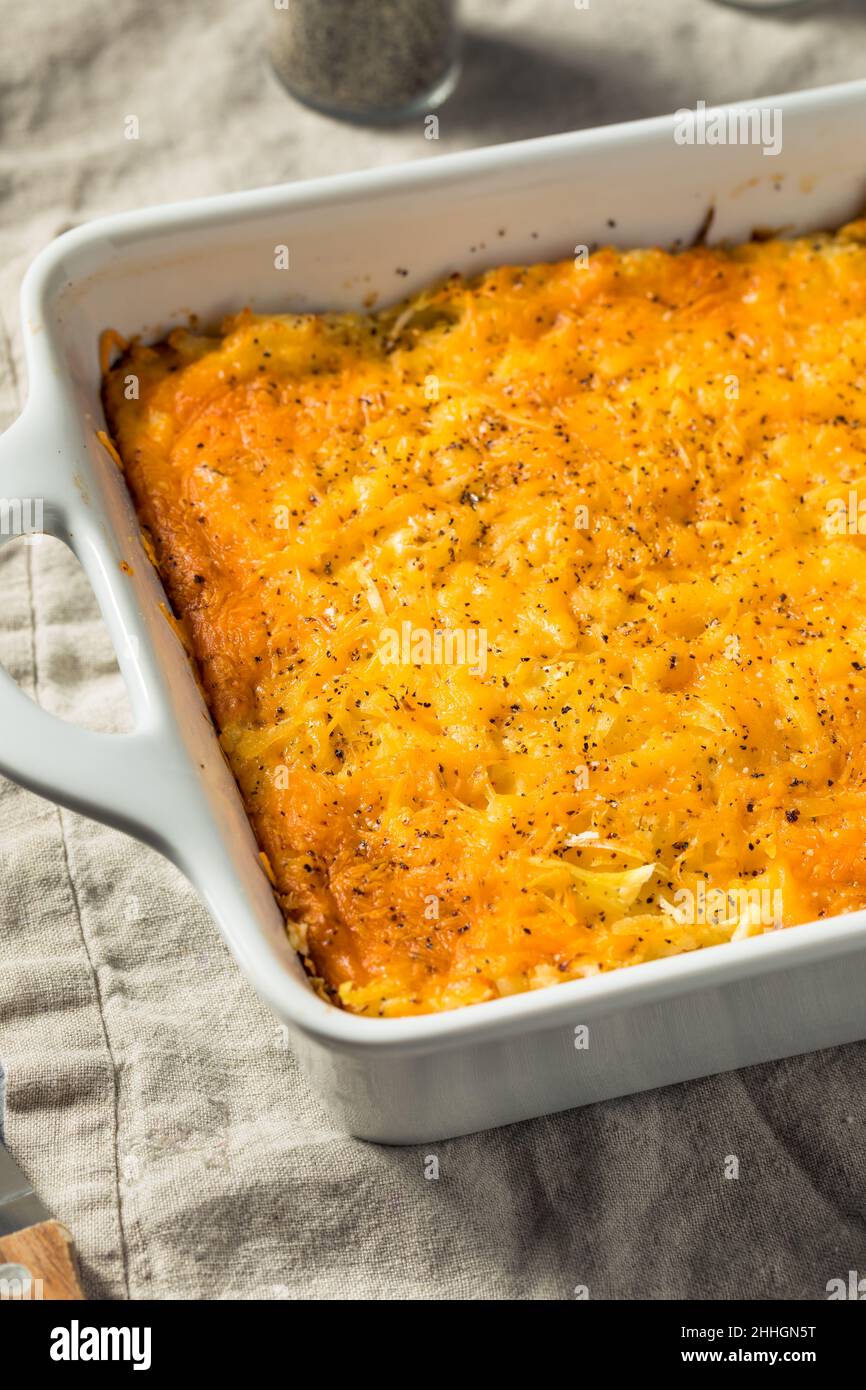 Homemade Cheesy Hashbrown Casserole with Potatoes and Cream Stock Photo