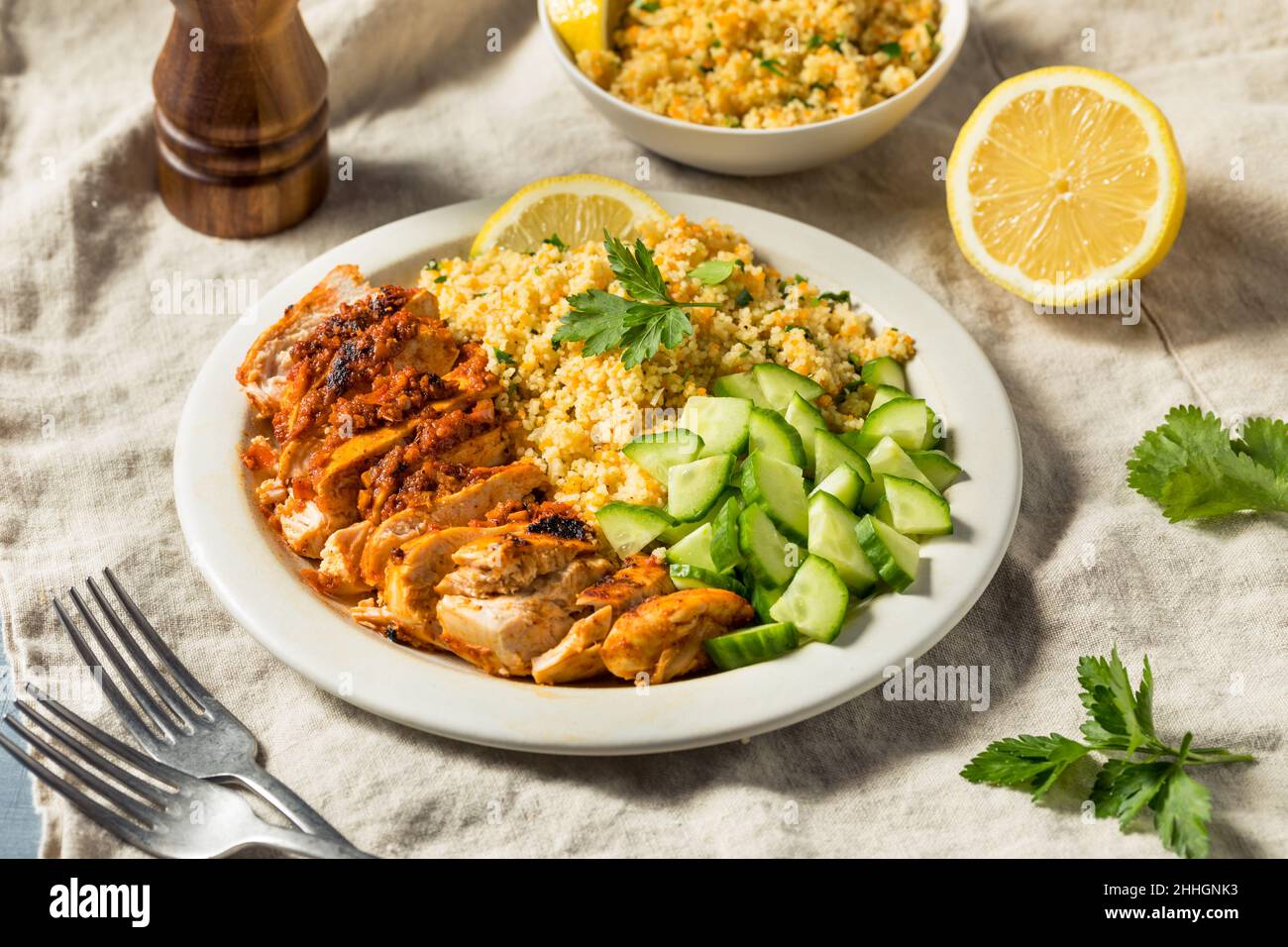 Homemade Harissa Chicken with Couscous and Cucumber Stock Photo Alamy