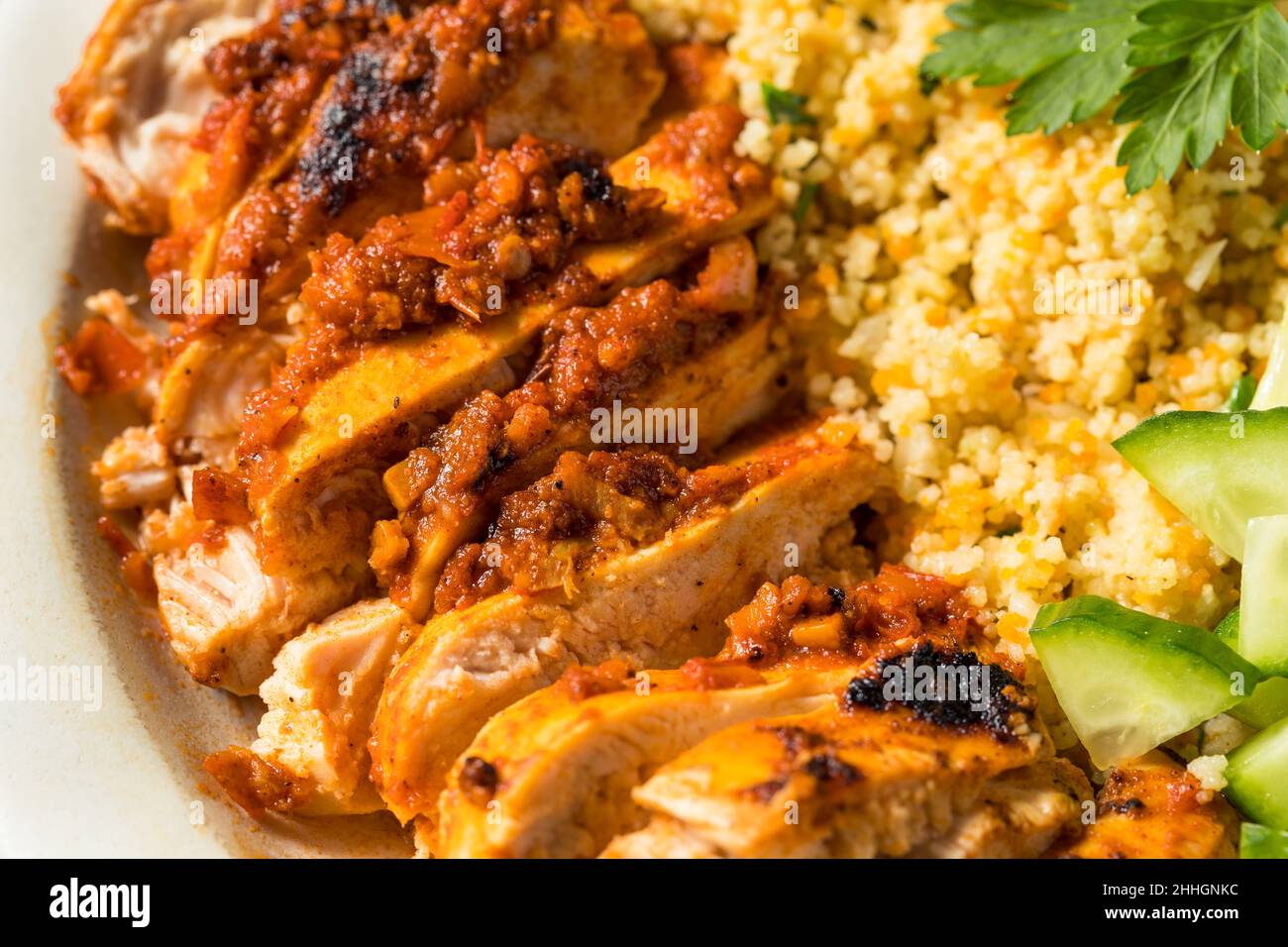 Homemade Harissa Chicken with Couscous and Cucumber Stock Photo - Alamy