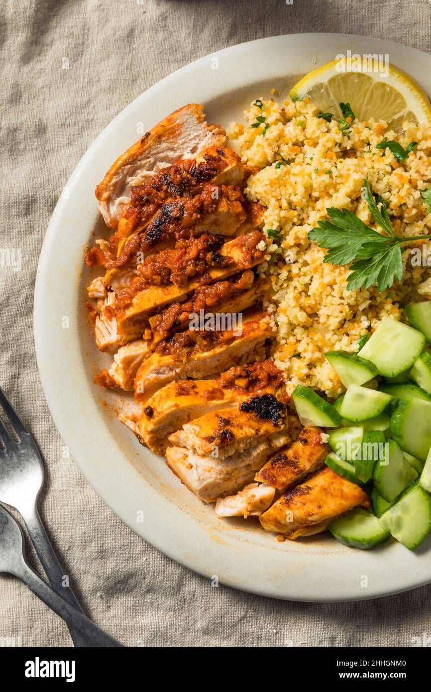 Homemade Harissa Chicken with Couscous and Cucumber Stock Photo Alamy