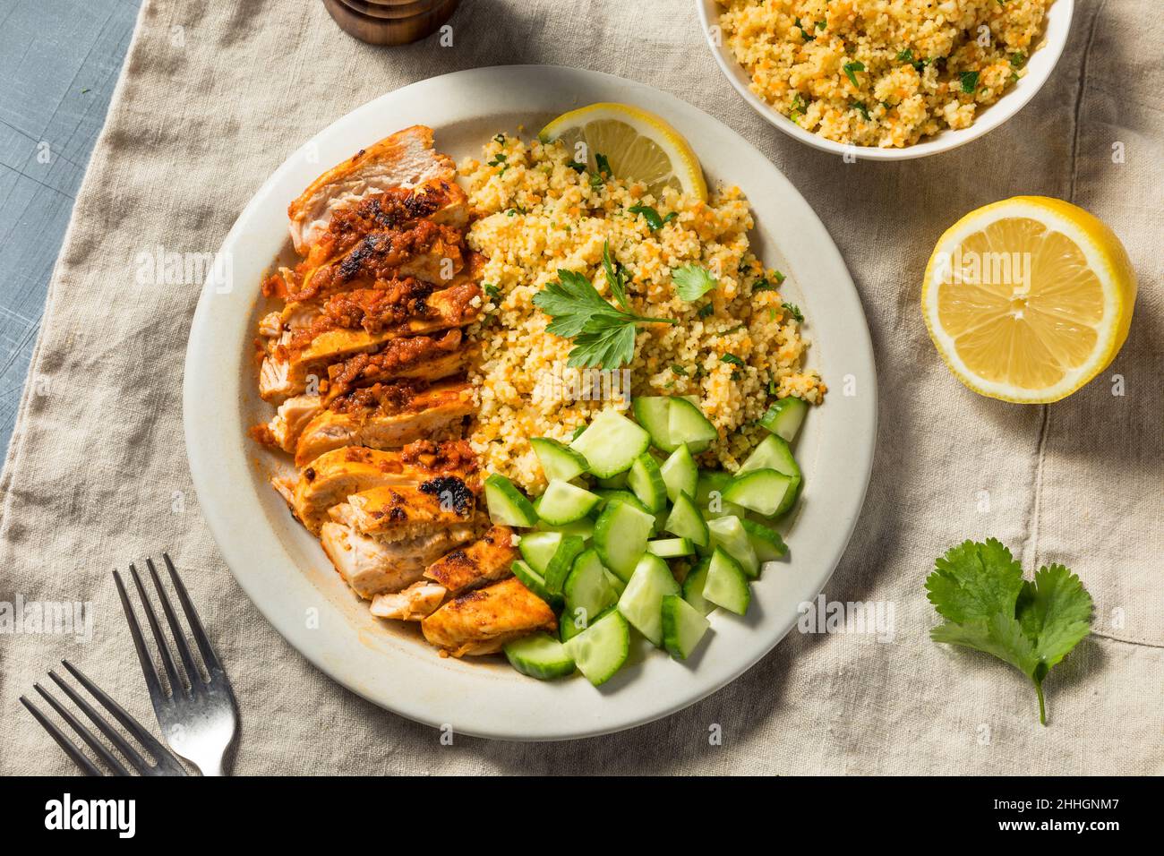 Homemade Harissa Chicken with Couscous and Cucumber Stock Photo - Alamy