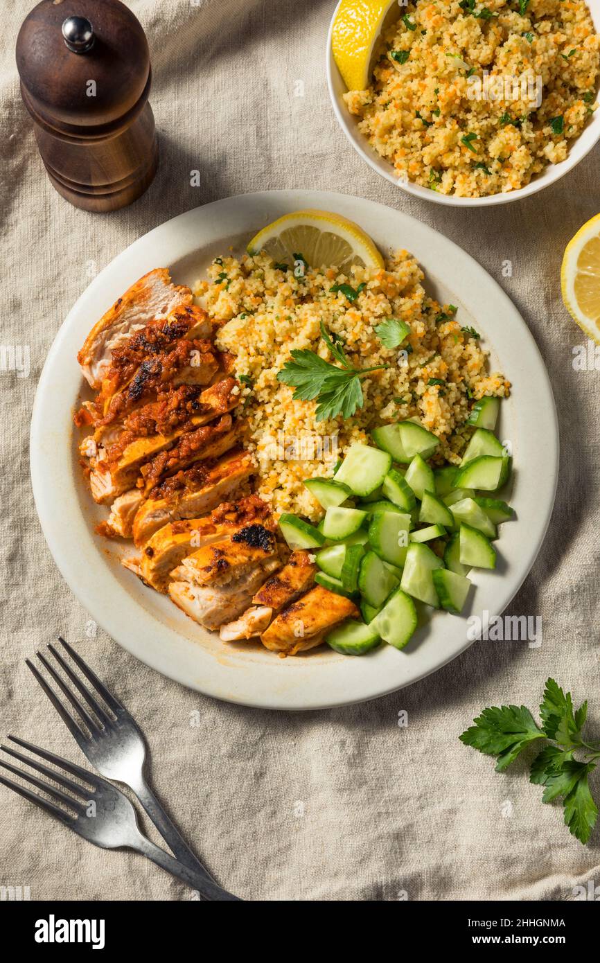 Homemade Harissa Chicken with Couscous and Cucumber Stock Photo Alamy