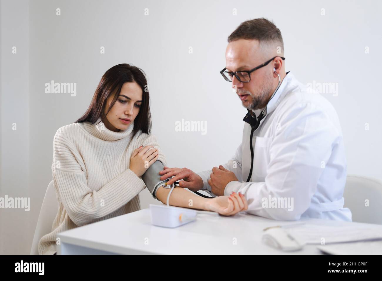 Visit man blood pressure measurement hi-res stock photography and ...