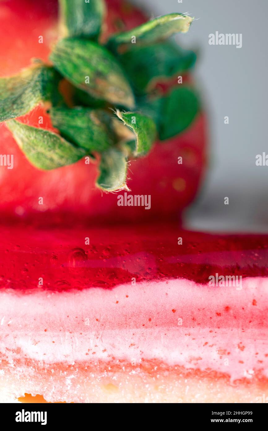 Macro close up shot of vanilla and strawberry slice of cake Stock Photo