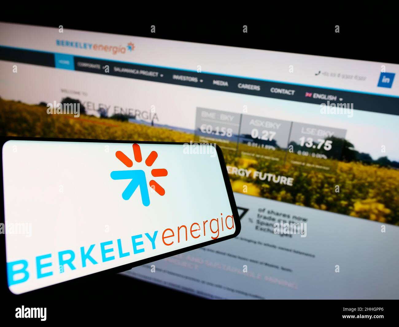 Mobile phone with logo of British energy company Berkeley Energia Limited on screen in front of website. Focus on center-right of phone display. Stock Photo