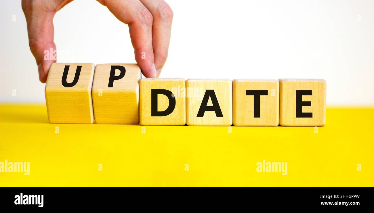 Date or update symbol. Businessman turns wooden cubes and changes the ...