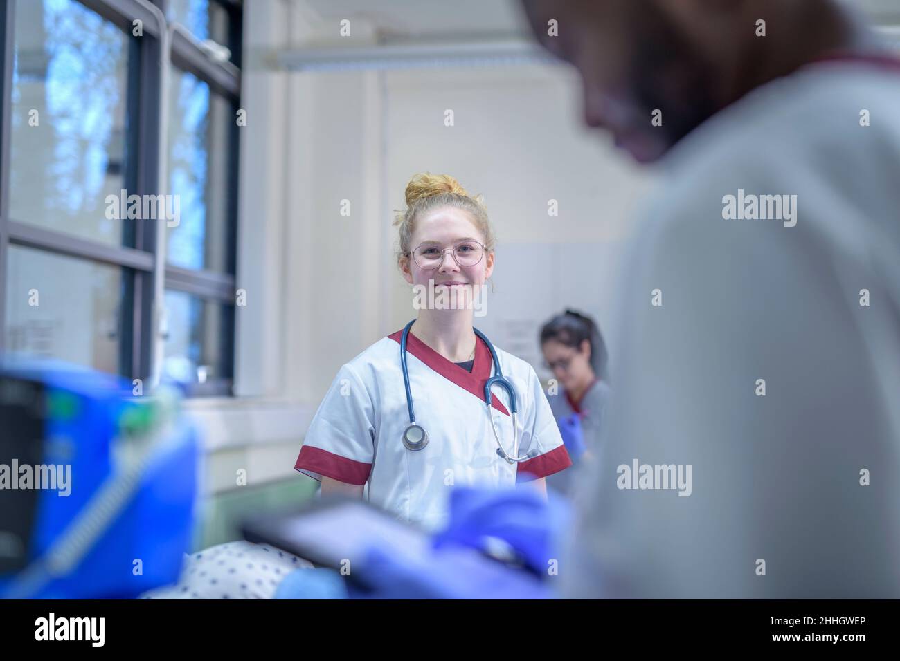 Portrait of smiling nurse on hospital ward Stock Photo