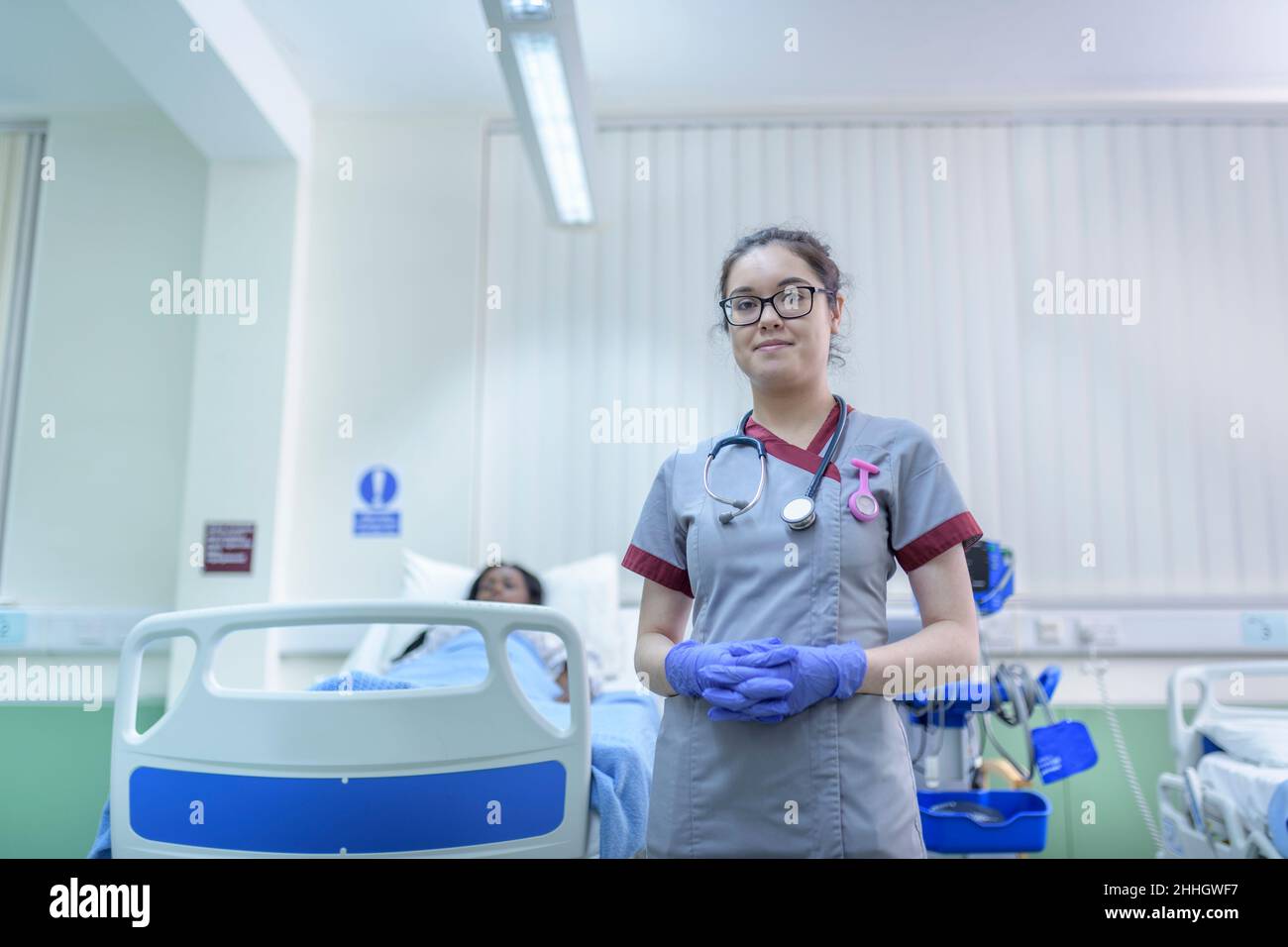 Portrait of smiling nurse on hospital ward Stock Photo