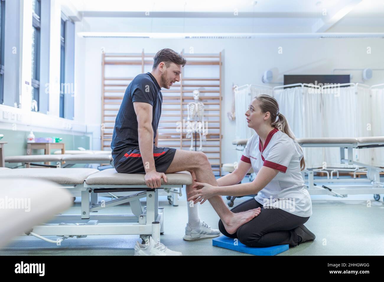 Physiotherapist with patient in hospital Stock Photo