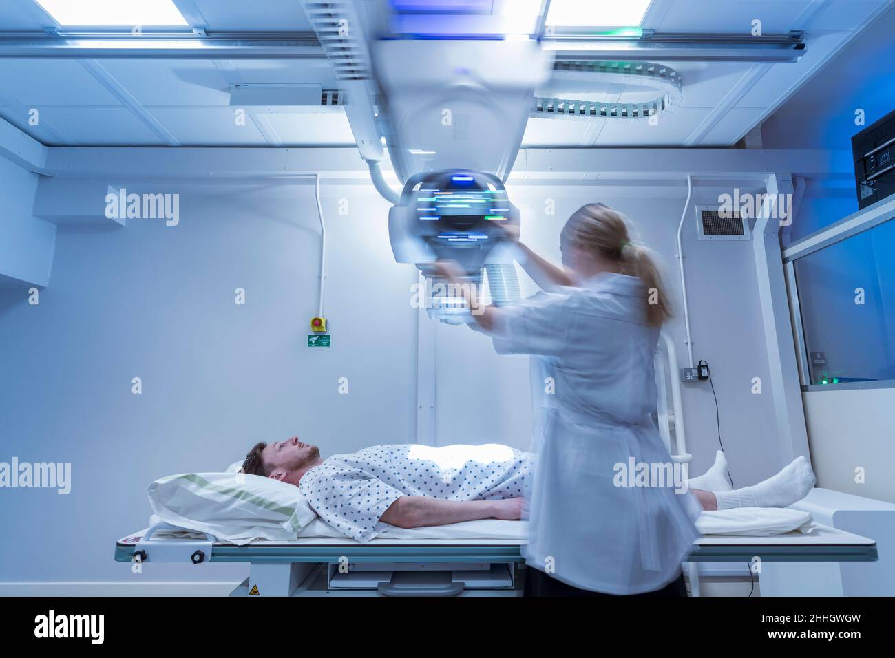 Radiologist setting up x-ray machine in hospital Stock Photo