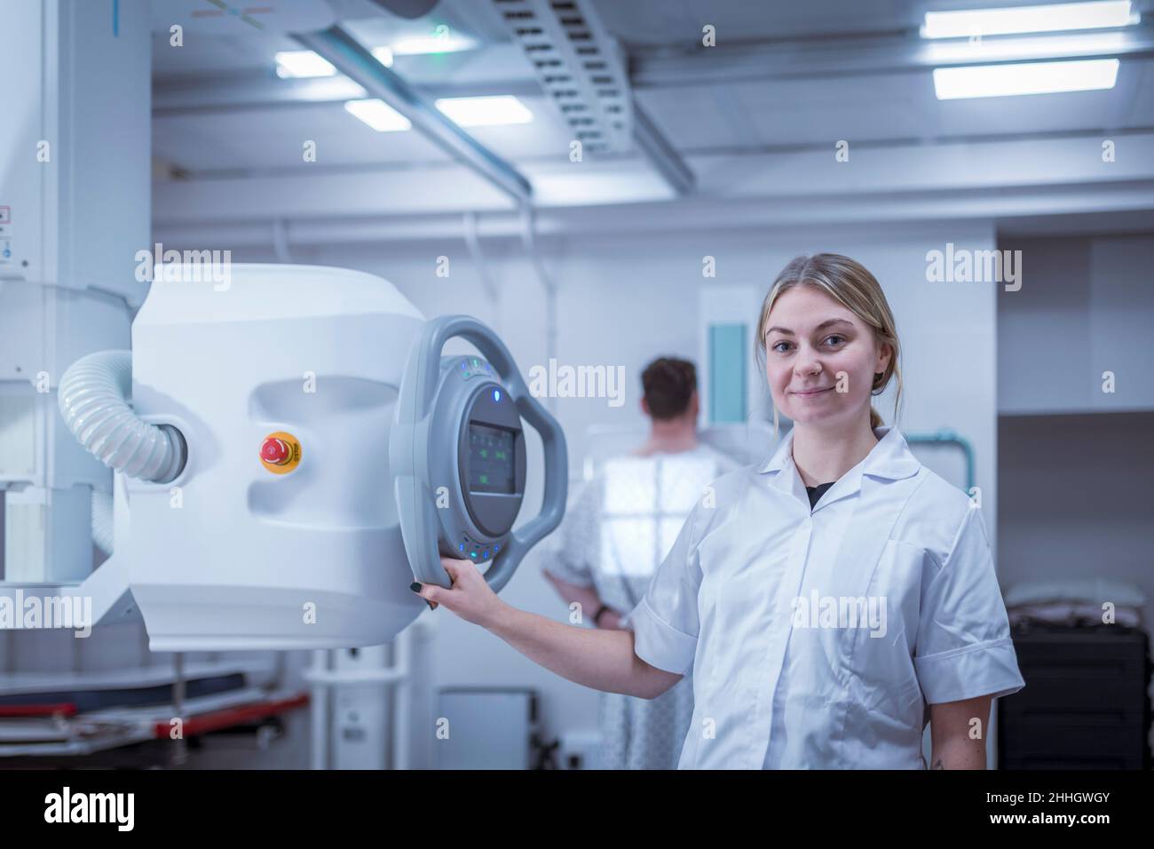 Portrait of radiologist setting up chest x-ray in hospital Stock Photo