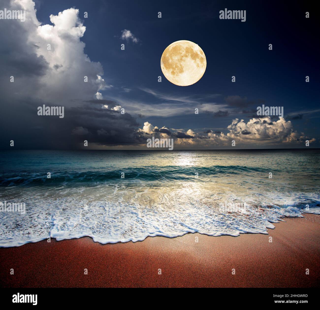 Sandy beach and moon at night Stock Photo