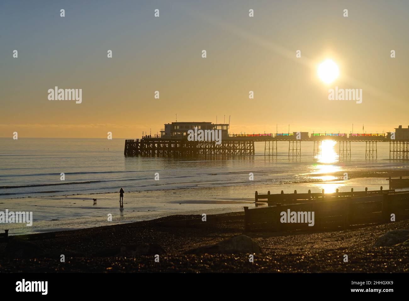 Worthing pier and beach at sunset on a cold winters day West Sussex England UK Stock Photo
