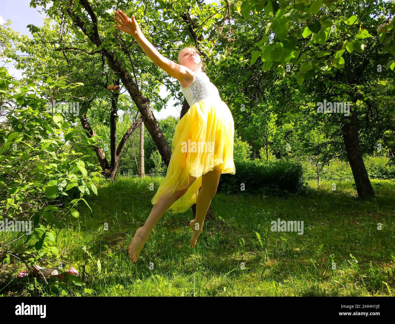 Adorable little girl playing in a summer park Stock Photo - Alamy