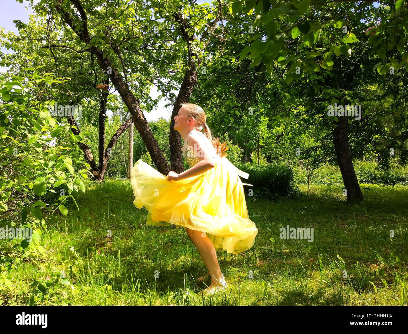 Adorable little girl playing in a summer park Stock Photo - Alamy