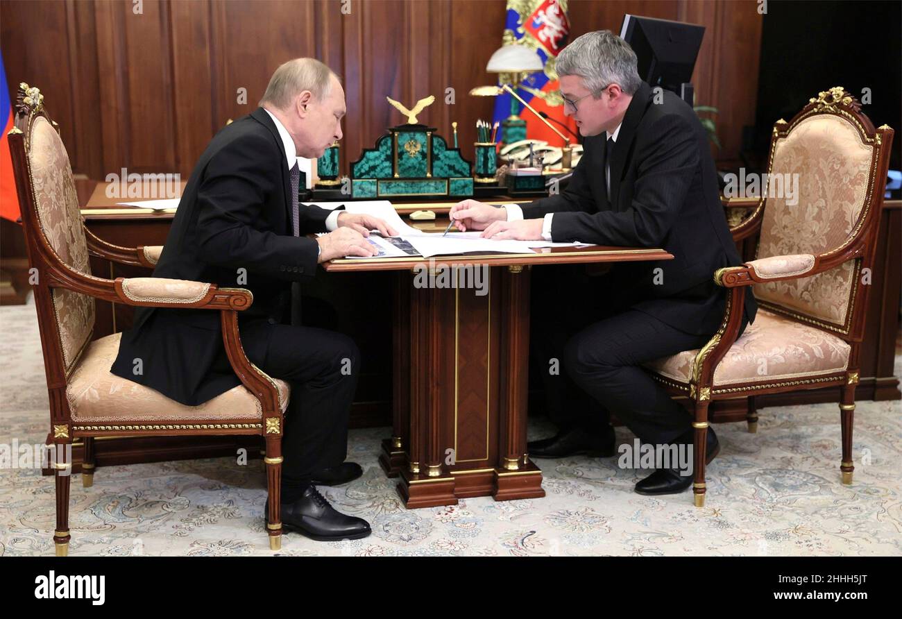 Moscow, Russia. 24th Jan, 2022. Russian President Vladimir Putin holds a face-to-face meeting with the Governor of Kamchatka Territory Vladimir Solodov, right, at the Kremlin, January 24, 2022 in Moscow, Russia. Credit: Mikhail Metzel/Kremlin Pool/Alamy Live News Stock Photo