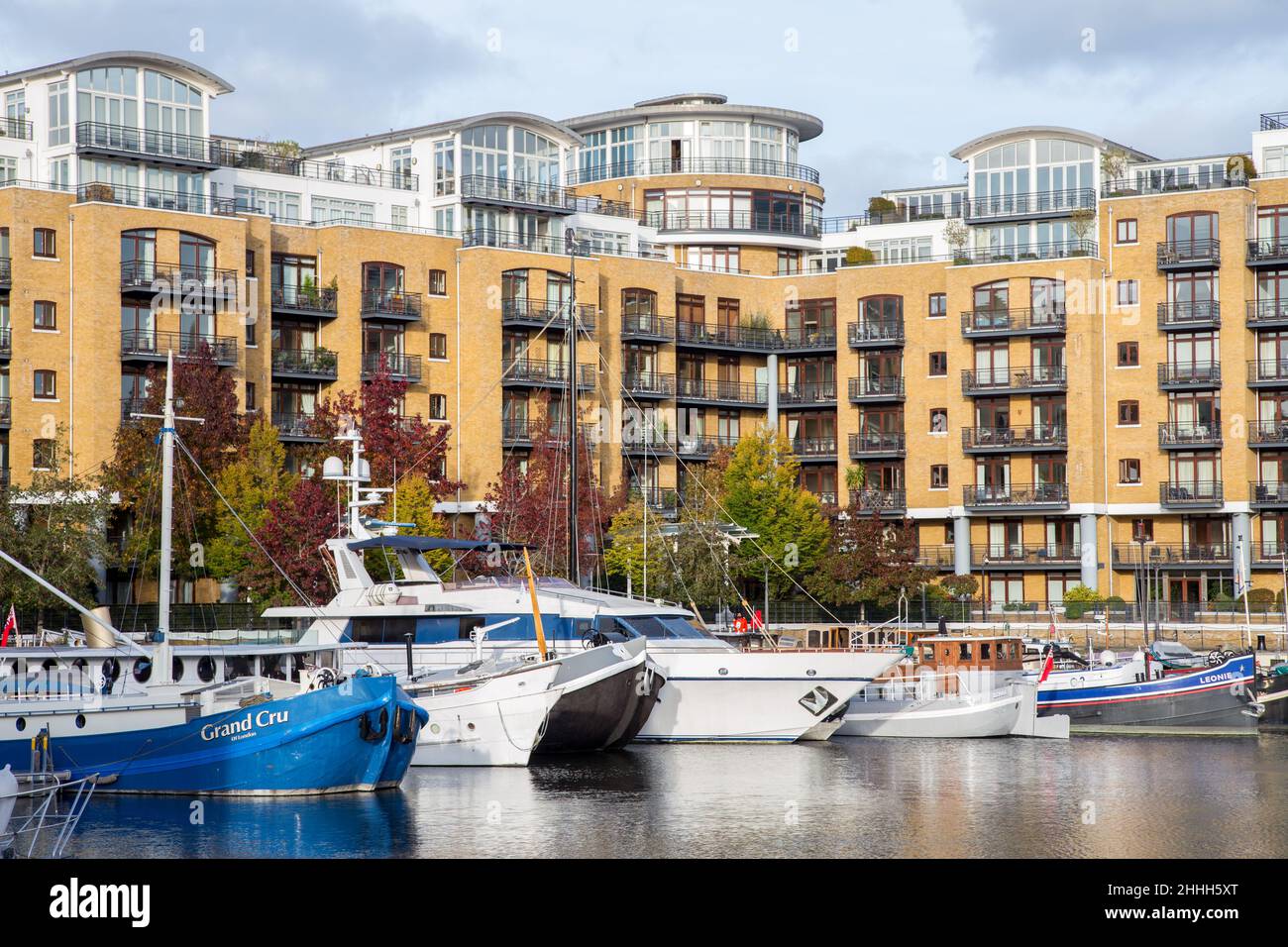 St Katharine Docks Marina boats and penthouse apartments, London Stock Photo