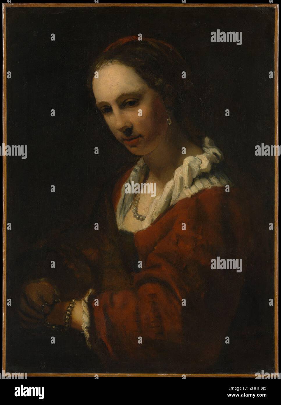 Young Woman with a Pearl Necklace Copy after Willem Drost Dutch The sitter bears a resemblance to Hendrickje Stoffels (born about 1625–26, died 1663), Rembrandt's common-law wife and the subject of a number of his portraits, one of which is in the Metropolitan. The picture is the work of a pupil of Rembrandt, and the strong light striking the face suggests that it may be by Barent Fabritius. Another version is in Dresden.. Young Woman with a Pearl Necklace. Copy after Willem Drost (Dutch, late 17th or early 18th century). Oil on canvas. Paintings Stock Photo