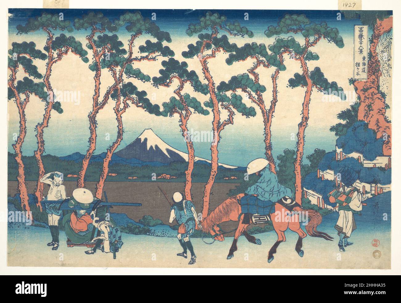 Hodogaya on the Tōkaidō (Tōkaidō Hodogaya), from the series Thirty-six Views of Mount Fuji (Fugaku sanjūrokkei) ca. 1830–32 Katsushika Hokusai Japanese Hodogaya, one of the well-known fifty-three stations of the Tōkaidō road, is located between Musashi, the province in which Edo was located, and Sagami Province to the west. At this point, westbound travelers were said to have finally felt the sensation of having put the metropolis of Edo behind them, for at Hodogaya the road stretches into a beautiful avenue lined with pine trees on both sides. When one travels on foot along a course near a bi Stock Photo