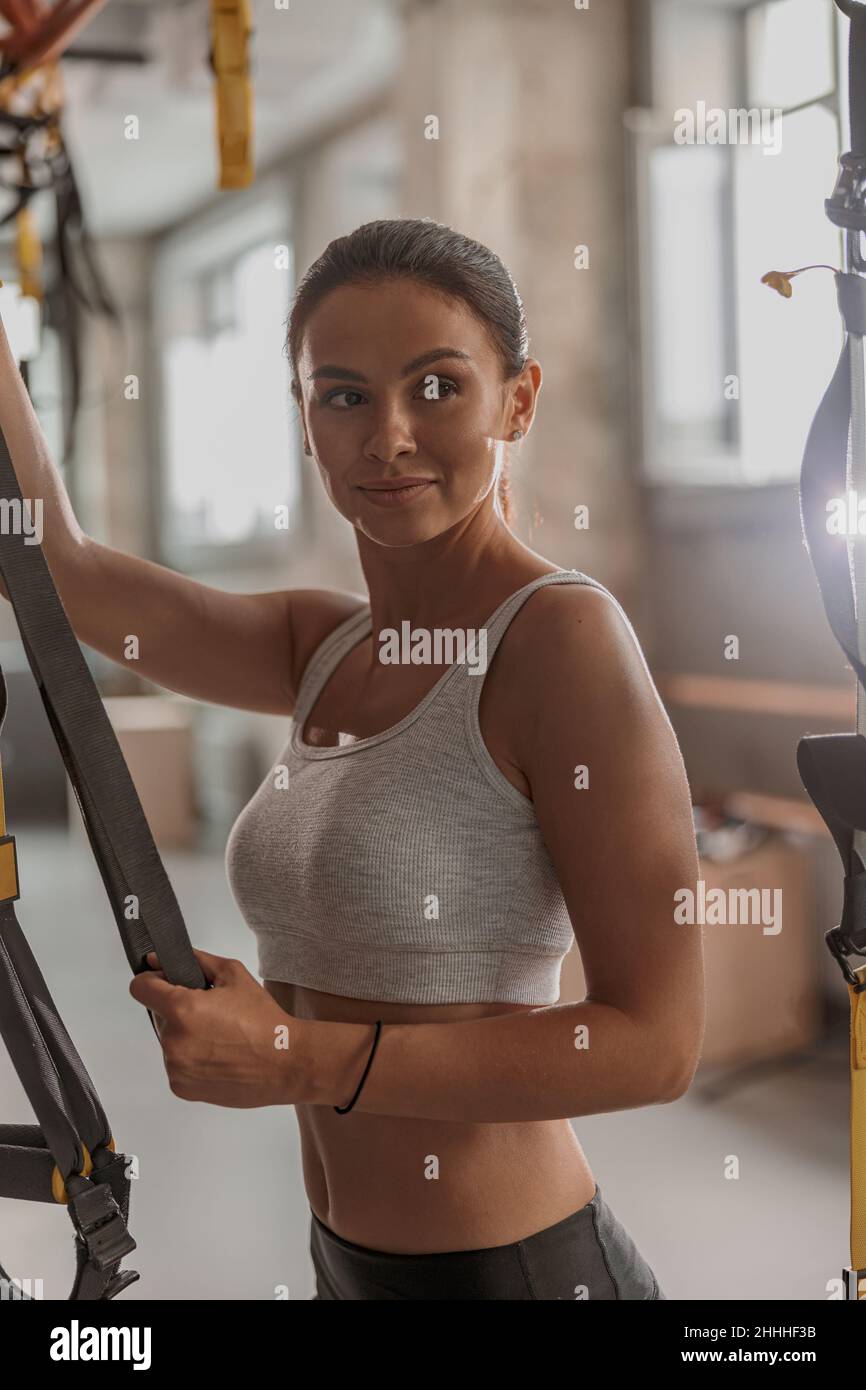 Young female athlete exercising in fitness club Stock Photo Alamy