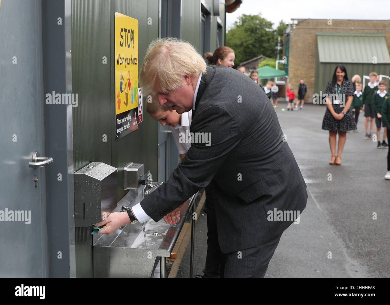 File photo dated 19/06/2020 of Prime Minister Boris Johnson uses a sink in the playground to wash his hands during a visit to Bovingdon Primary School in Bovingdon, Hemel Hempstead, Hertfordshire. Boris Johnson was facing fresh allegations of breaking coronavirus rules after it emerged a gathering to wish him a happy birthday was held inside No 10 during the first lockdown. Issue date: Monday January 24, 2022. Stock Photo
